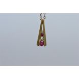 An attractive teardrop ruby and diamond pendant on fine link chain. Est. £30 - £40.