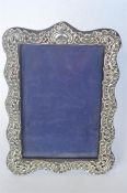 An attractive scroll embossed picture frame. Birmingham 1899. By AC&MC. Est. £75 - £85.