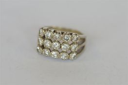A good 18ct white gold modern diamond cluster ring. Est. £250 - £300.