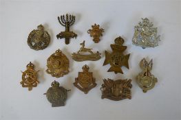 The Westminster Regiment badge together with numerous other badges. Est. £20 - £30.