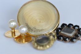 An Antique mourning brooch together with studs, lockets etc. Est. £15 - £20.