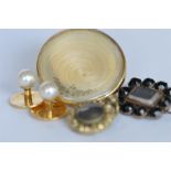 An Antique mourning brooch together with studs, lockets etc. Est. £15 - £20.