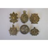 A Scottish Kings Borders badge together with The Black Watch badge and others. Est. £40 - £50.