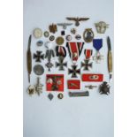 A box containing various Nazi medals etc. Est. £30 - £40.