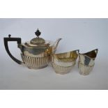 A good quality three piece tea set of half fluted design. Sheffield. By R&B. Approx. 890 grams. Est.