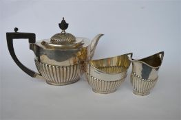 A good quality three piece tea set of half fluted design. Sheffield. By R&B. Approx. 890 grams. Est.