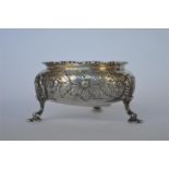 An attractive Victorian single salt decorated with flowers and leaves on hoof feet with gilt