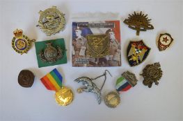 A Liverpool Scottish The Kings badge together with other medals and badges. Est. £20 - £30.