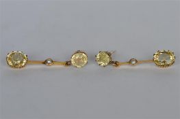 A good quality pair of boxed yellow sapphire and pearl earrings. Est. £700 - £800.