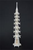 A carved ivory pagoda of tapered structure. Approx 23.5 cms high. Est. £20 - £30.