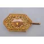 An attractive scroll decorated 9ct aide memoire with loop top. Birmingham 1900. Approx. 13 grams.