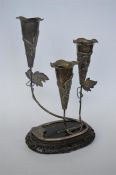 A good Chinese graduated three trumpet epergne with leaf decoration and wavy edge on hardwood