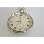 A heavy silver pocket watch with white enamel dial and engine turned back. By SYMA. Est. £60 - £70.