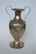 A good quality heavy vase with two loop handles, decorated with daffodils. London 1908. Approx 630