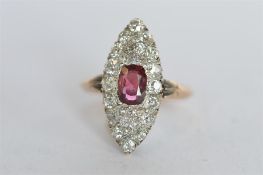 A good diamond and garnet marquise cluster ring in 18ct claw mount. Est. £700 - £750.