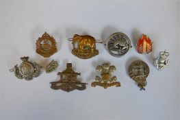 A Fishguard badge together with numerous other badges. Est. £30 - £40.