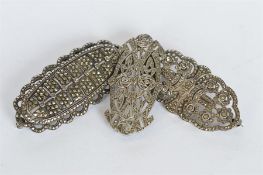 A group of three good silver and marcasite brooches. Est. £35 - £40.