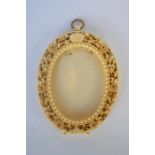 A good oval carved ivory picture frame with loop top and ball feet. Approx. 12 cms high by 9 cms