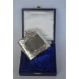A good quality boxed hip flask engraved with scrolls and flowers. Birmingham mod. By CB&S. Approx