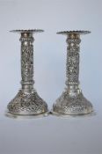 A good pair of Indian candlesticks decorated with palm trees and animals. Approx 260 grams. Est. £