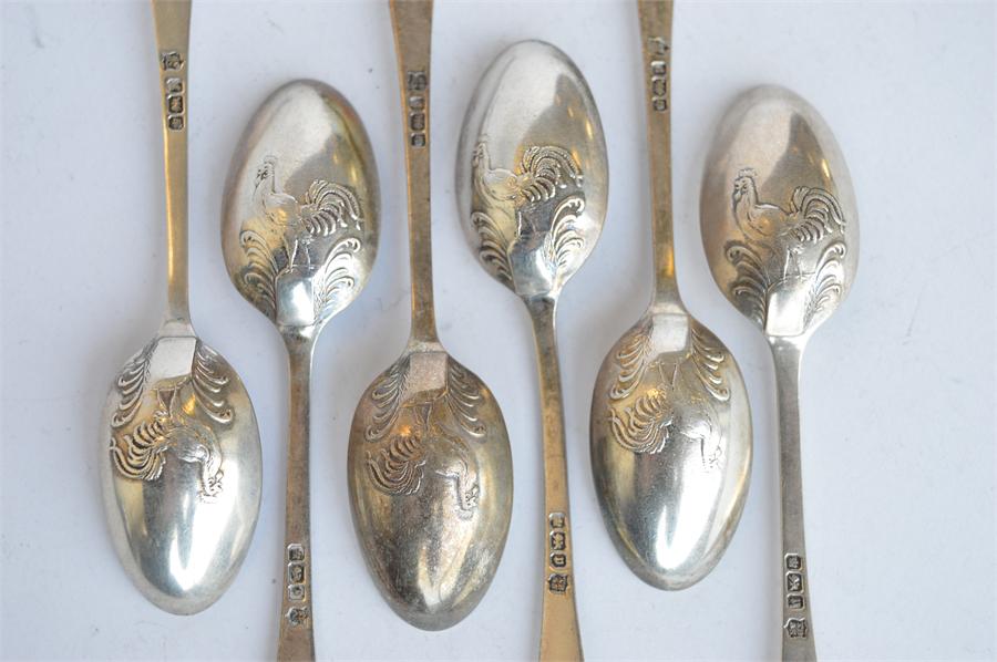 A set of six OE picture back teaspoons mounted with cockerel. Sheffield 1907. By TB&S. Est. £30 - £