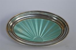 An attractive oval enamelled pin dish. Birmingham 1928. By A Bros. Est. £100 - £120.