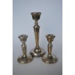 A pair of circular piano candle sticks together with one other. Birmingham. By  B&C. Est. £10 - £