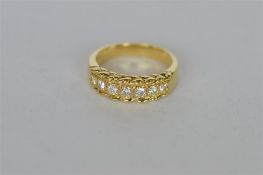 A good quality seven stone diamond ring set in gold. Est. £500 - £600.