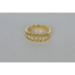 A good quality seven stone diamond ring set in gold. Est. £500 - £600.