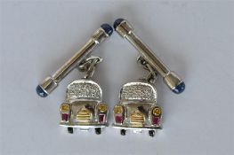 A good pair of 18ct white gold diamond cufflinks in the form of cars. Est. £450 - £500.