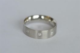 A good quality platinum band nine stone ring. Est. £380 - £420.