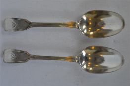 A good pair of fiddle and thread dessert spoons. London 1842. By GA. Approx. 104 grams. Est. £