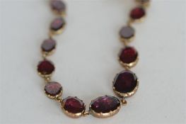 A good quality Victorian flat link garnet bracelet. Est. £350 - £400.