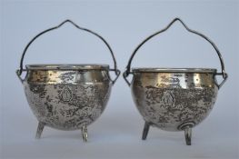 A good pair of Victorian cauldron shaped salts with swing handles. London 1862. By GA. Est. £90 - £