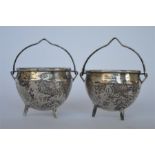 A good pair of Victorian cauldron shaped salts with swing handles. London 1862. By GA. Est. £90 - £