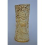 A Chinese well carved bone / horn brush pot decorated with dragons and a Buddha. Est. £50 - £60.