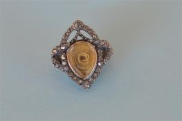 An unusual miniature diamond mourning brooch with hair centre. Est. £60 - £80.