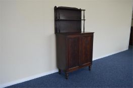 A Georgian slim chiffonier on turned feet with shelved interior. Approx 140 cms tall. Est. £200 - £