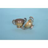 A pair of heavy small two handled trophy cups. London 1906. By Goldsmiths & Silversmiths. Approx.