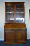 A large mahogany bureau bookcase with cross banded decoration and fitted interior. Est. £280 - £