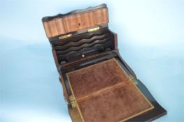 An attractive mahogany writing slope with hinged top, and fitted interior. Est. £150 - £200.