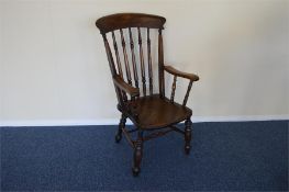 A large good quality stick back chair on turned supports. Est. £50 - £60.