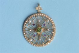 An Antique 15ct peridot, amethyst and pearl circular pendant with loop top. Est. £600 - £650.