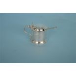 A silver mustard pot and cover with hinged thumb piece. Birmingham. By M & W. Approx 290 grams. Est.
