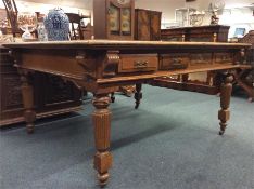 A good large oak desk with eight drawers on reeded legs with brass handles. Est. £450- £500.