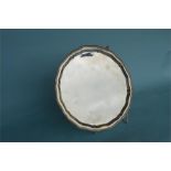 A good heavy circular salver with reeded rim on ball and claw feet. Approx. 850 grams. Est. £