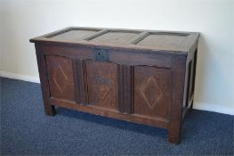 A large heavy Antique oak coffer with string inlay. Est. £100 - £150.