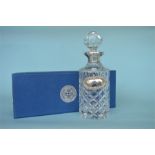 A good quality boxed Millenium hallmark silver mounted decanter with matching label, in fitted