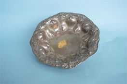 An attractive embossed circular Art Deco dish decorated with flowers and leaves. Marked Alvin.
