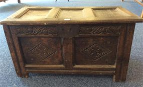 A good small Antique oak coffer with carved decoration. Est. £250 - £300.